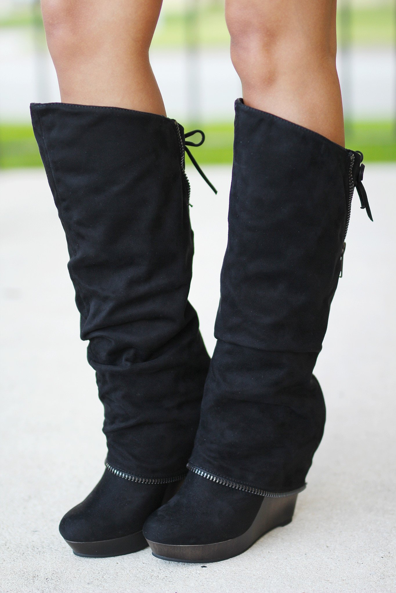 The versatile black wedge boots