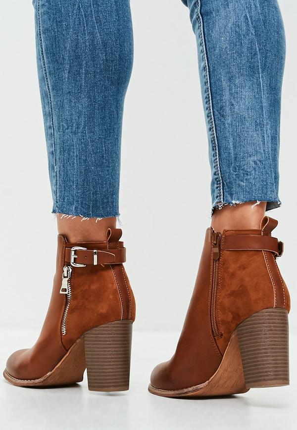 Carrying the perfect brown heeled boots